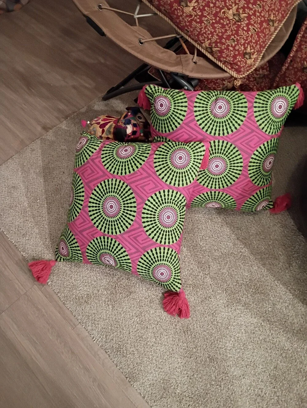 Decorative Toss Pillow with Pink Tassels and Green Geometric Medallion Pattern